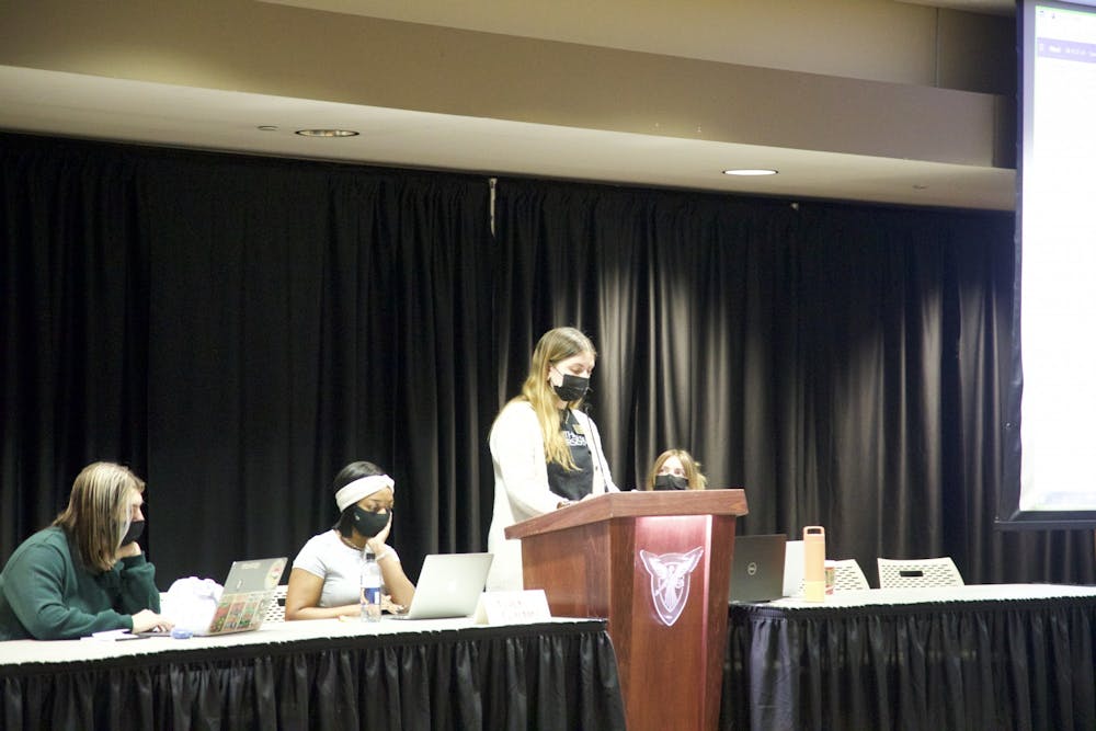 <p>Student Government Association (SGA)&#x27;s Vice President, Chiara Biddle, reads one of the two new amendments that were introduced to SGA in the L.A Pittenger Student Center on Jan. 26, 2022. Both of the introduced amendments are about the election process.<strong> Hannah Amos, DN</strong></p>
