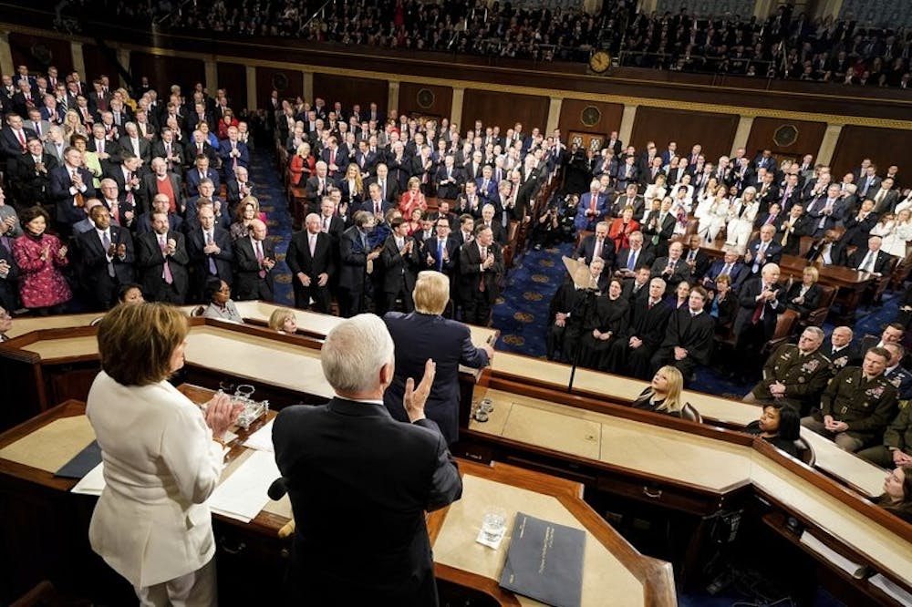 <p>President Donald Trump delivers his State of the Union address to a joint session of Congress on Capitol Hill in Washington, Tuesday, Feb. 4, 2020, as House Speaker Nancy Pelosi of Calif., left, and Vice President Mike Pence watch. <strong>(Doug Mills/The New York Times via AP, Pool)</strong></p>