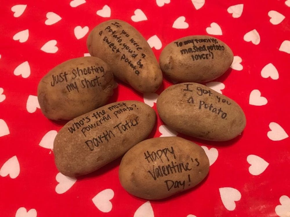 <p>A pile of potatoes sits covered in Valentine's Day messages for Camp Kesem's potatogram fundraiser. Camp Kesem is selling potatograms for $3 and are delivering them on Valentine's Day for students on and off campus and is taking order until noon Wednesday. <strong>Photo Provided, Ryan Marsh</strong></p>