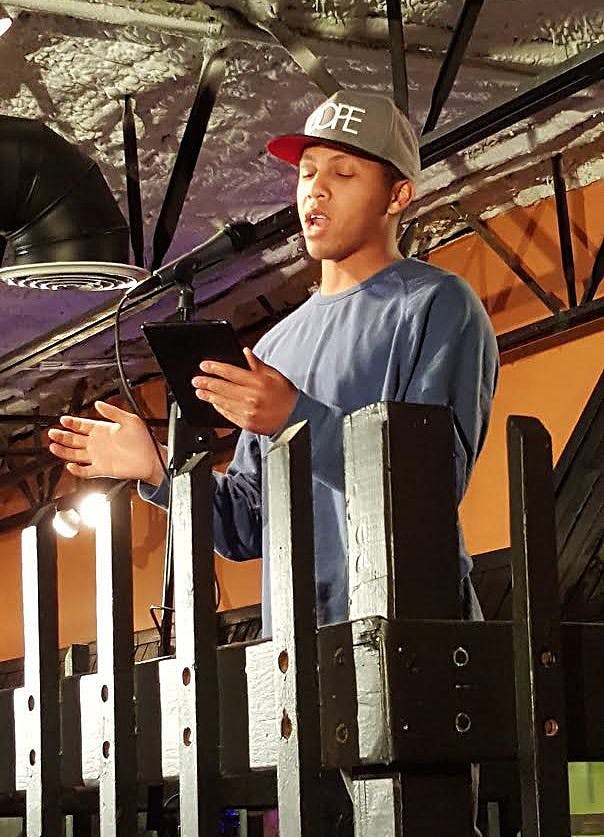 Al Jennings spoke at the Two Cats&nbsp;Café open mic night on Valentine's Day&nbsp;that was hosted by the poetry group Reacting Out Loud. DN PHOTO ALLISON NUSBAUM