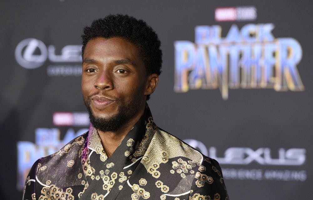FILE - In this Jan. 29, 2018 file photo, Chadwick Boseman, a cast member in "Black Panther," poses at the premiere of the film in Los Angeles. Actor Chadwick Boseman, who played Black icons Jackie Robinson and James Brown before finding fame as the regal Black Panther in the Marvel cinematic universe, has died of cancer. His representative says Boseman died Friday, Aug. 28, 2020 in Los Angeles after a four-year battle with colon cancer. He was 43. (Photo by Chris Pizzello/Invision/AP, File)