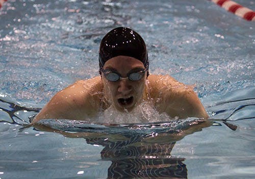 Junior Bridgette Ruehl races in the women’s 100-meter breaststroke against Eastern Michigan. Ruehl won first place in 100 and 200-meter breaststroke. DN PHOTO EMMA FLYNN