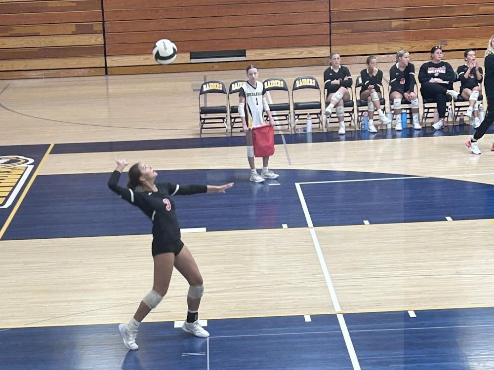 Marin Hopkins serves to Shenandoah, in 3-0 sweep. Photo by Kenna Geibel