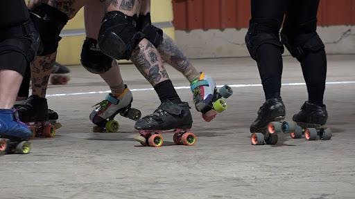 Cornfed Roller Derby blocking in a roller derby match