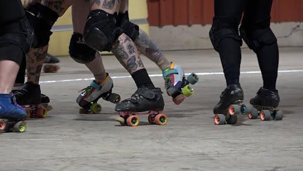 Cornfed Roller Derby blocking in a roller derby match