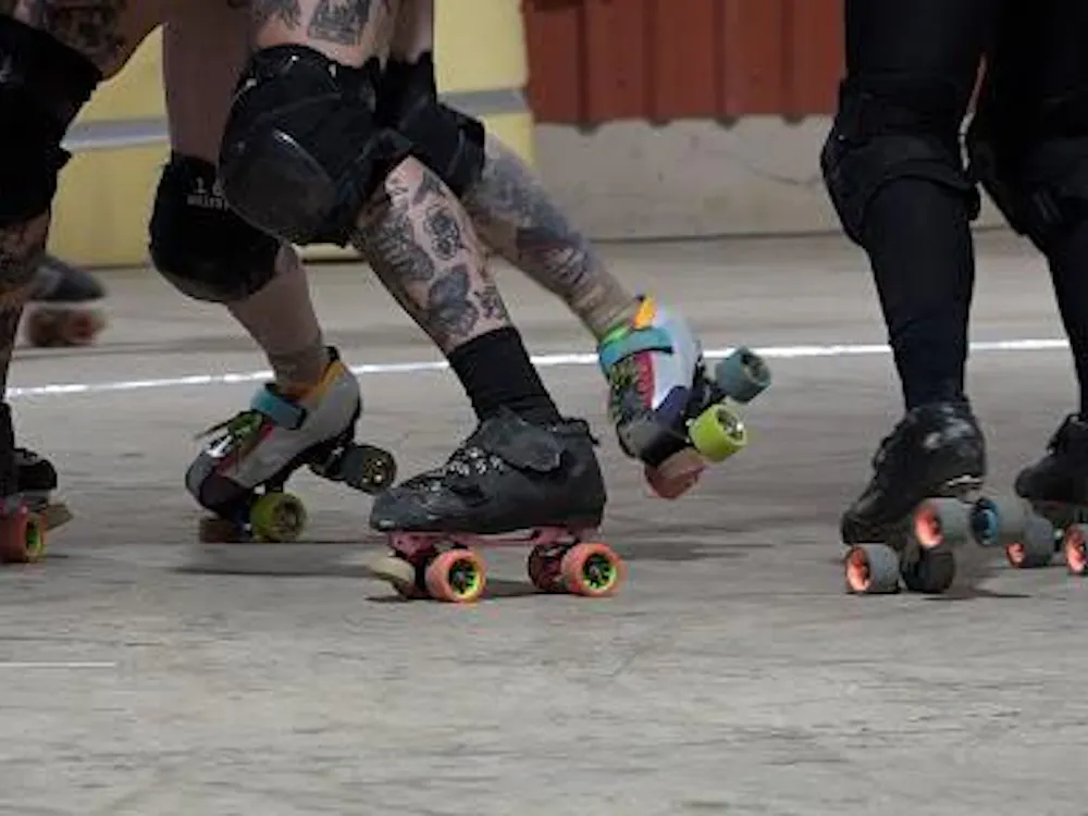 Cornfed Roller Derby blocking in a roller derby match