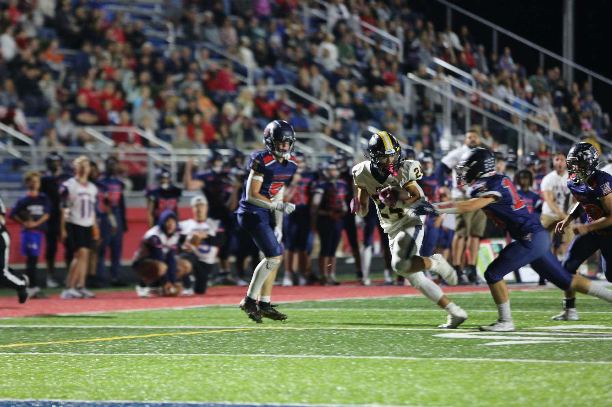Junior Aven Thomas evades two Patriot defenders late in the fourth to set the Eagles up with a first down in the redzone. The Eagles would go on to get stopped at the goal line.