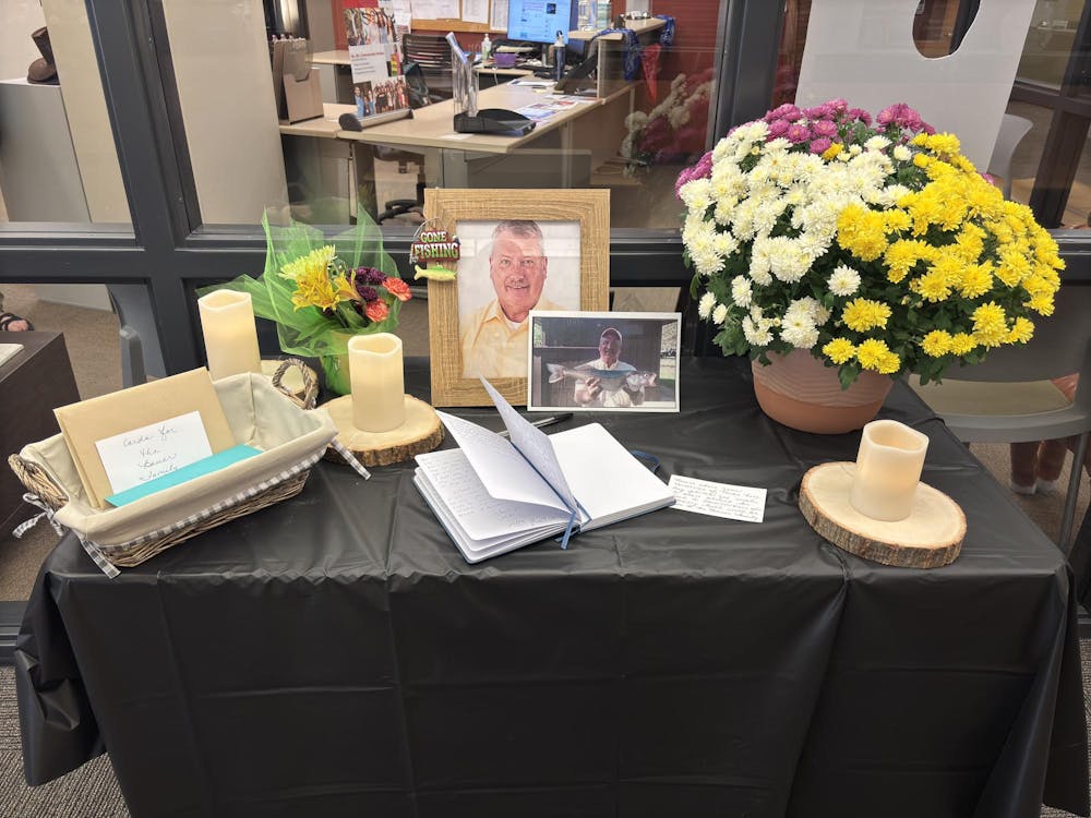 <p>A table with notes and memories of professor Michael Bauer is photographed Oct. 22 on the third floor of the Letterman Building. It was publicly announced Bauer died in an Instagram post made by the Ball State Communication Studies Department. Trinity Rea, DN</p>