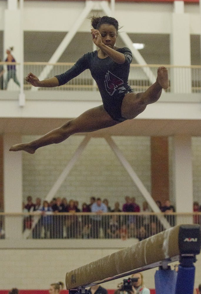 Junior Denasiha Christian performs on the beam for the meet against Florida on Jan. 12 at Irving Gymnasium. DN PHOTO BREANNA DAUGHERTY