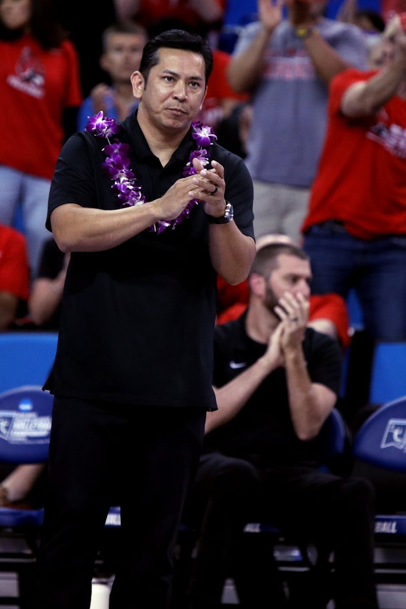 Ball State Men's Volleyball Head Coach Donan Cruz claps after the Cardinals score a point in NCAA Semifinals against Hawaii May 6 at Pauley Pavilion in Los Angeles, California. Ball State lost to Hawaii 2-3. Amber Pietz, DN
