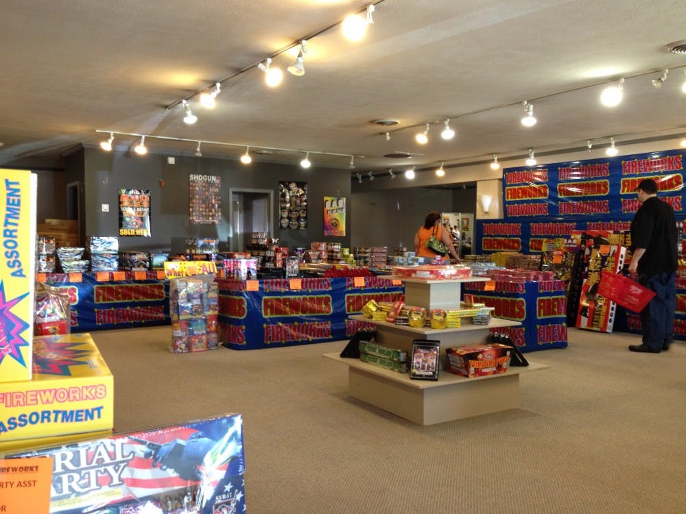 Muncie residents shop in a pop up fireworks shop on Wheeling Avenue. Aaron Wood, a Muncie Fire Department lieutenant inspector, said most accidents and injuries are a result of small fountain and sparkler fireworks. DN FILE PHOTO ASHLEY DYE