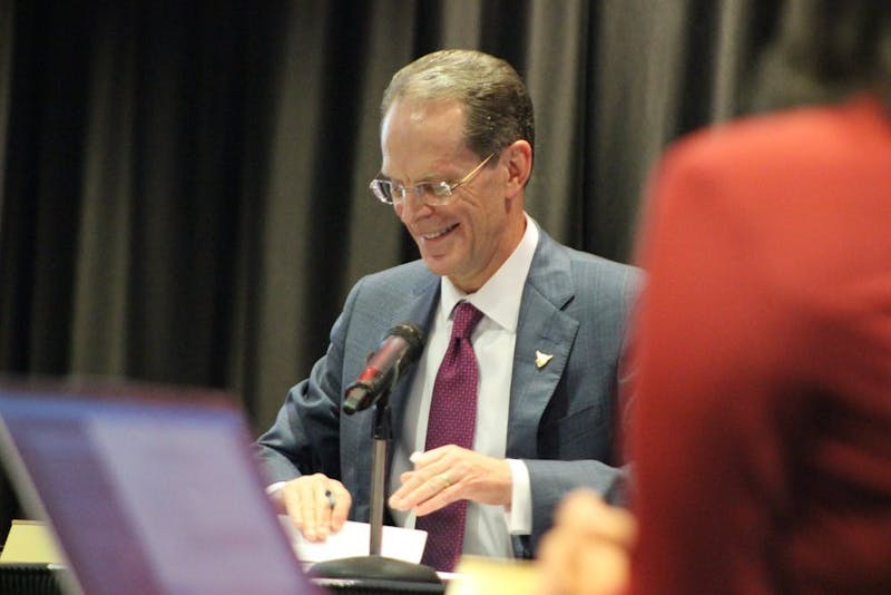 In this Jan. 31, 2020, photo, President Geoffrey Mearns signs the documentation to extend his presidency at Ball State's Board of Trustees meeting. Ball State will begin to reopen campus and campus activities in three phases. Bailey Cline, DN&nbsp;