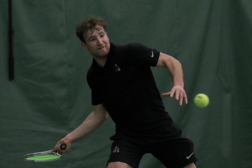 <p>Junior Nathaniel Webster prepares to hit back the ball during a singles against Cleveland State University Feb. 10. at Muncie YMCA. Webster won both sets 5-4 and 7-6. Kate Tilbury, DN</p>