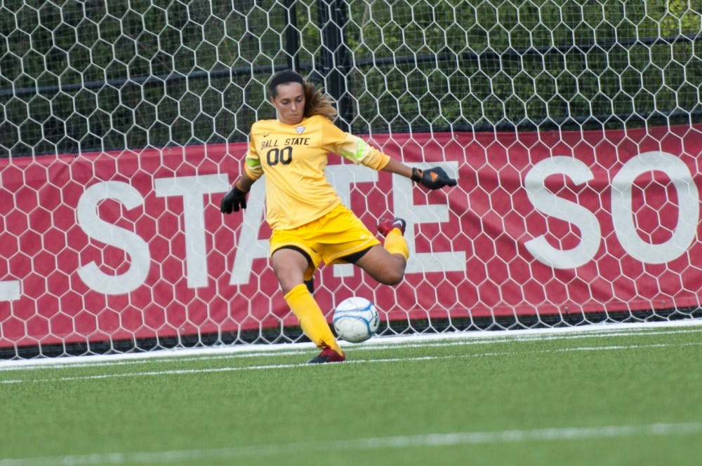 Sophomore goal keeper Brooke Dennis clears the net during Ball State