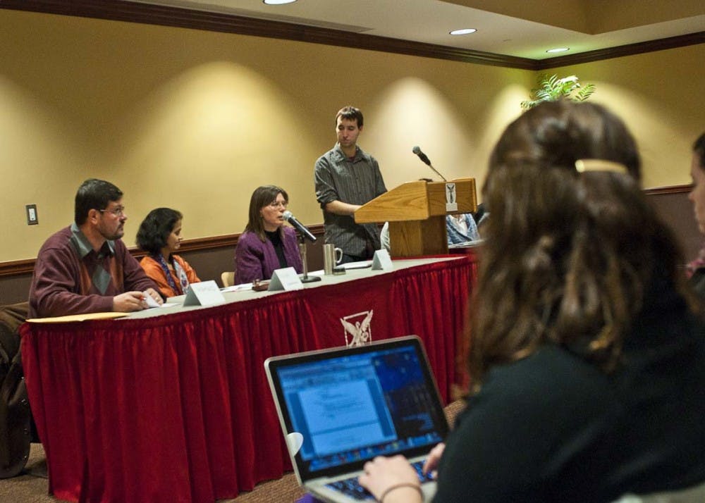 Students take notes as various religious community leaders speak on environmental issues and their religious implications. The board attempted to represent a majority of major religions, including Islam, Buddhism, Hinduism and Christianity. DN PHOTO JONATHAN MIKSANEK