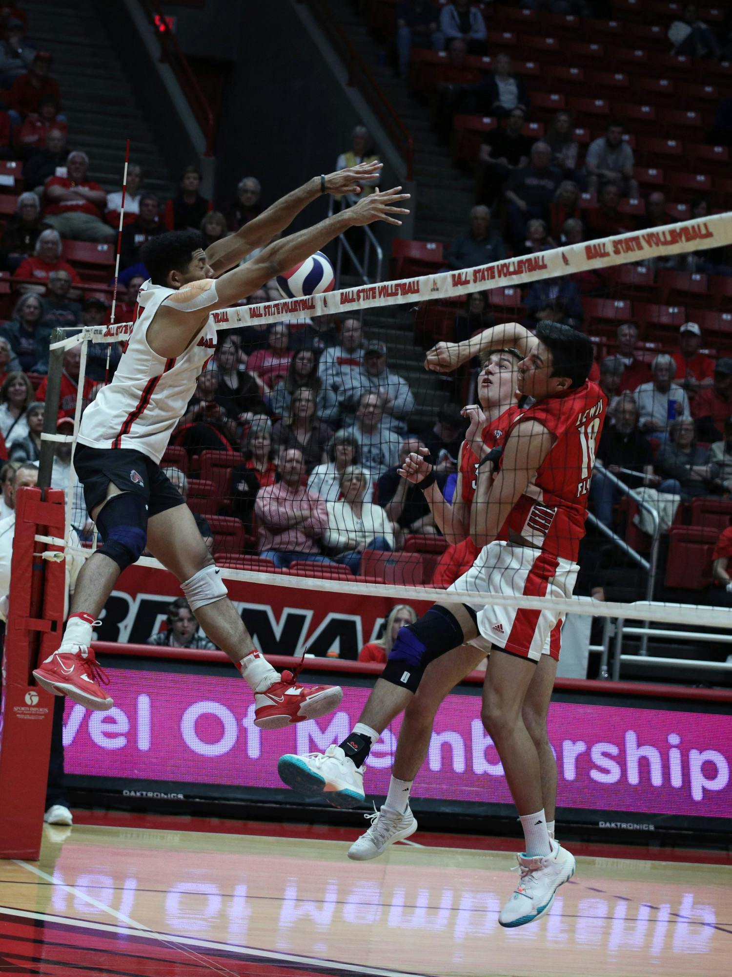 Graduate student middle blocker Felix Egharevba blocks the ball against Lewis University April 19 at Worthen Arena. Egharevba scored 12 points in the game. Mya Cataline, DN