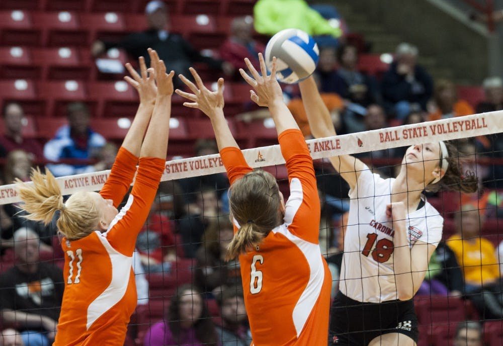 Junior middle hitter Hayley Benson attempts the kill against Bowling Green State University during the game Oct. 25 at Worthen Arena. Ball State lost the game, 1-3. DN PHOTO JONATHAN MIKSANEK