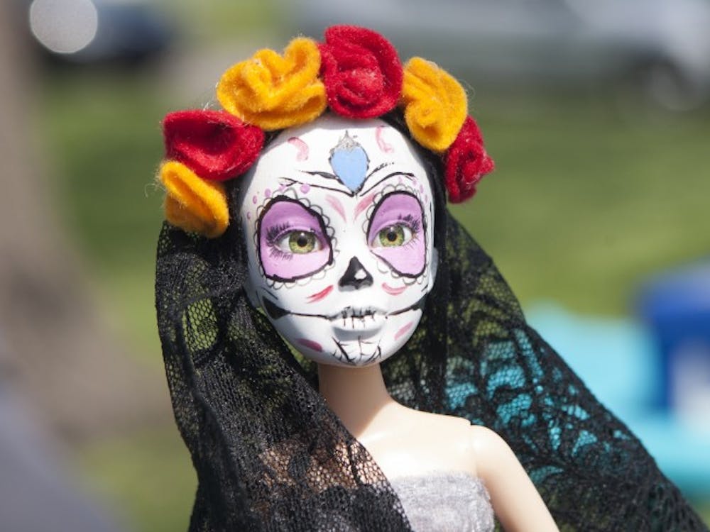 Heekin Park was host to a verity of people selling handmade creations, including this customized doll, on May 17. The doll was one of many crafts available for sale that included decor, toys, clothing and jewelry. DN PHOTO JORDAN HUFFER