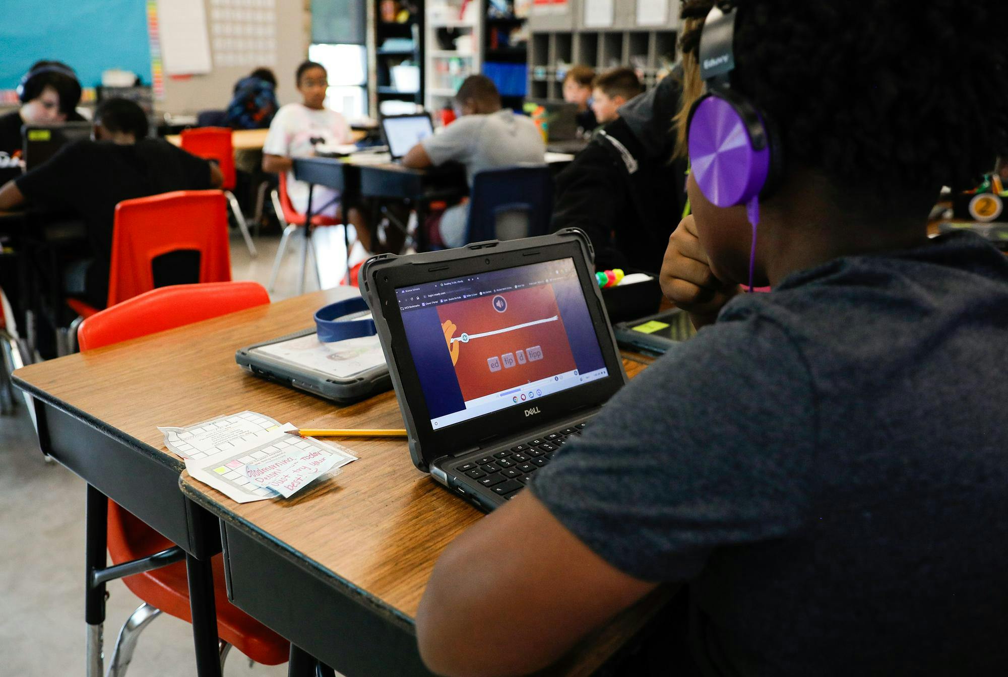 A fifth-grade student does online work in Michale Kissick’s classroom Oct. 1 at East Washinton Academy. 
