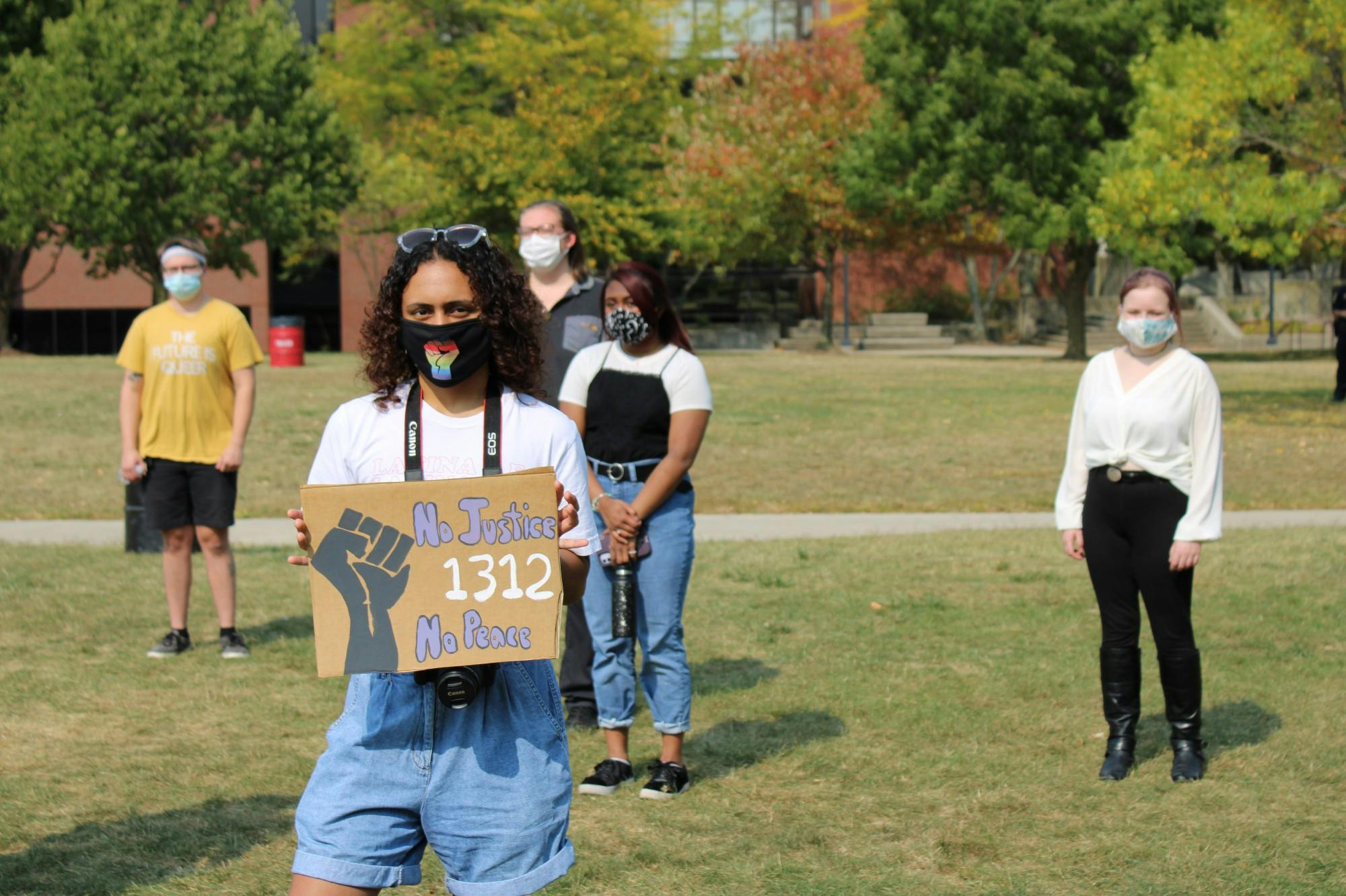Students stand socially distant on University Green at the &quot;Emphasizing Equity&quot; event Sept. 26, 2020. Approximately 40 students, activists and organizers gathered to discuss solutions to racial injustice. Angelica Gonzalez Morales, DN