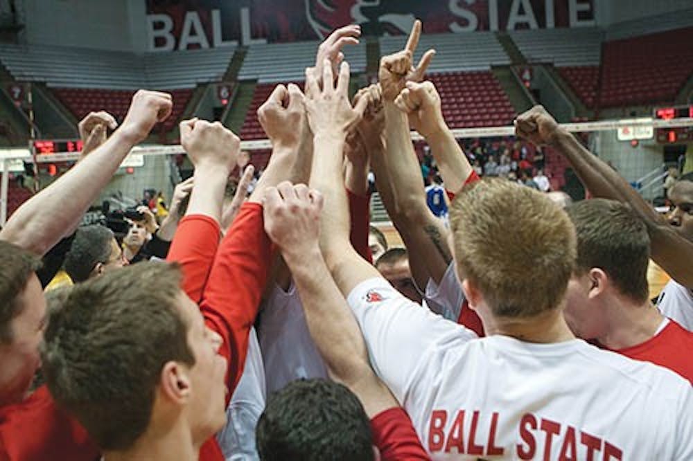 The men’s volleyball team celebrate their victory over IPFW on Saturday night. With this win, the Cardinals have a 21-5 record and will advance to the next round of the MIVA Tournament on April 24. DN PHOTO JORDAN HUFFER