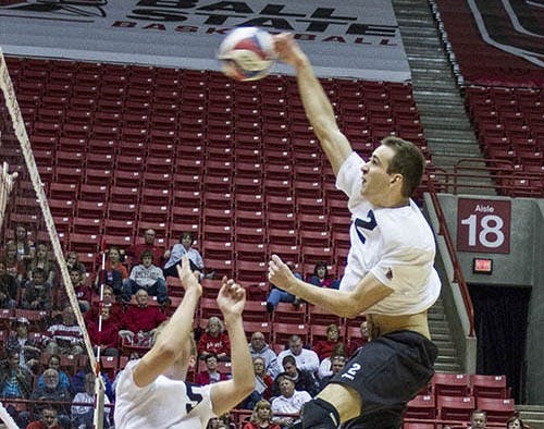 Junior Graham McIlvaine sets the ball to senior Matt Leske Jan. 12 against St. Francis. The Cardinals will take on Quincy Feb. 1. DN FILE PHOTO EMMA FLYNN