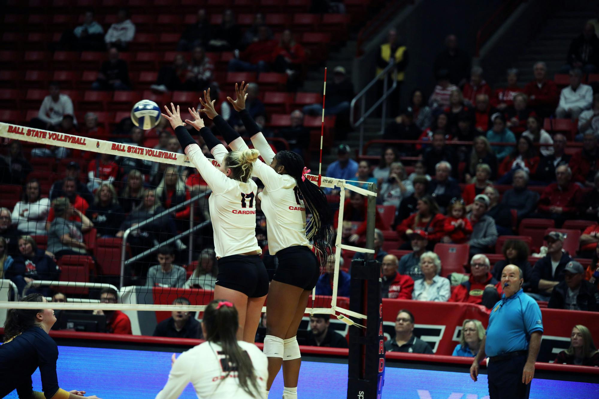 Freshman middle blocker Camryn Wise (left) and redshirt freshman middle blocker Aniya Kennedy (right) block the ball against Toledo Oct. 17 at Worthen Arena. Mya Cataline, DN