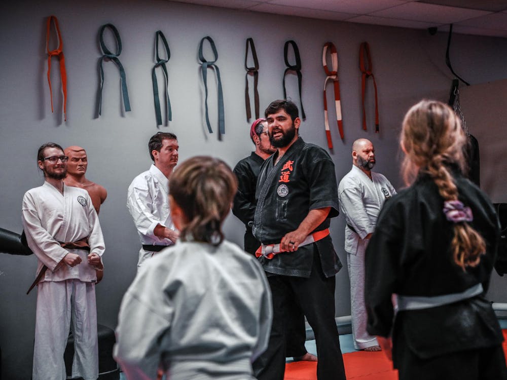 Master Richard Rymer talks to his students to close the class Nov. 28 at White and Rymer Bushido Dojo. Andrew Berger, DN