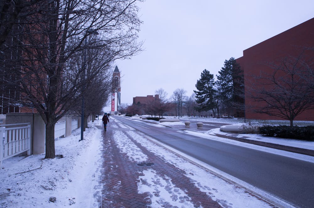 <p>A student walks to class Jan. 29, 2019 on Ball State's campus. The National Weather Service issued a winter weather advisory Nov. 11-12, 2019, warning of 2-3 inches of snow, dramatically colder temperatures and hazardous road conditions. <strong>Scott Fleener, DN File</strong></p>