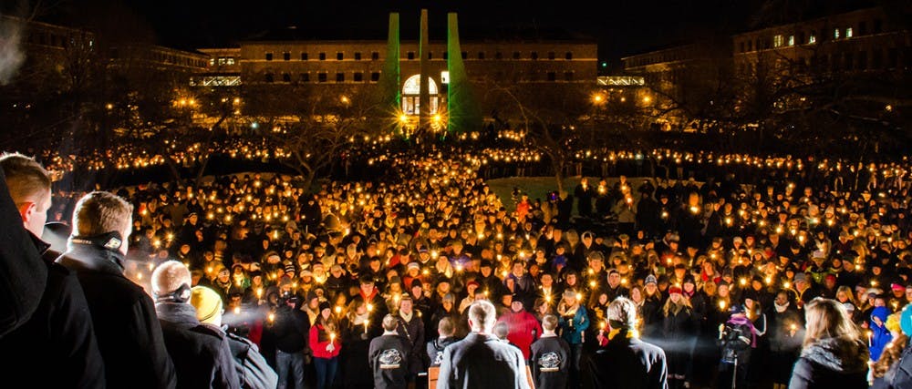 The Purdue University community gathers at the candlelight vigil in memory of Andrew Boldt. The senior electrical engineering major died Tuesday afternoon after being shot in the Electrical Engineering Building. PHOTO COURTESY OF Marshall Farthing