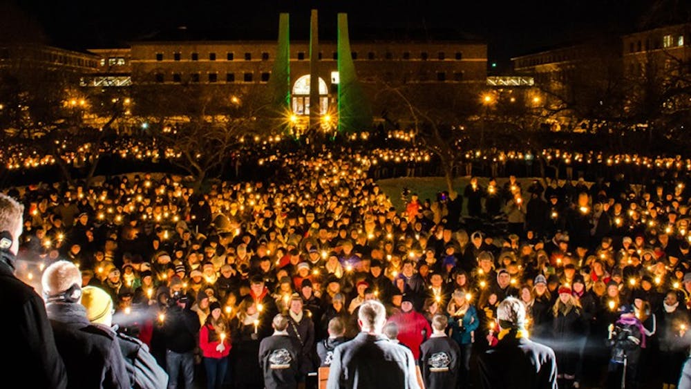 The Purdue University community gathers at the candlelight vigil in memory of Andrew Boldt. The senior electrical engineering major died Tuesday afternoon after being shot in the Electrical Engineering Building. PHOTO COURTESY OF Marshall Farthing
