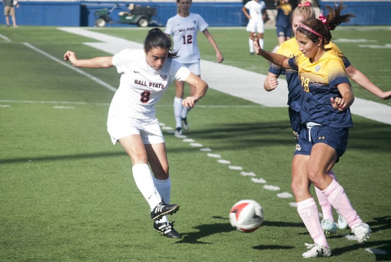Sophomore midfielder Paula Guerrero dribbles the ball in overtime at Kent State. Ball State won 2-1 in overtime and moved to first place in the MAC. DN//Colin Grylls