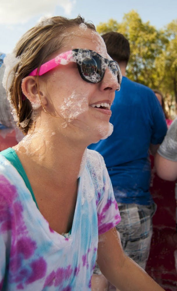 Freshman Becca Dodge gets off the ground after wrestling with a friend. DN PHOTO BOBBY ELLIS