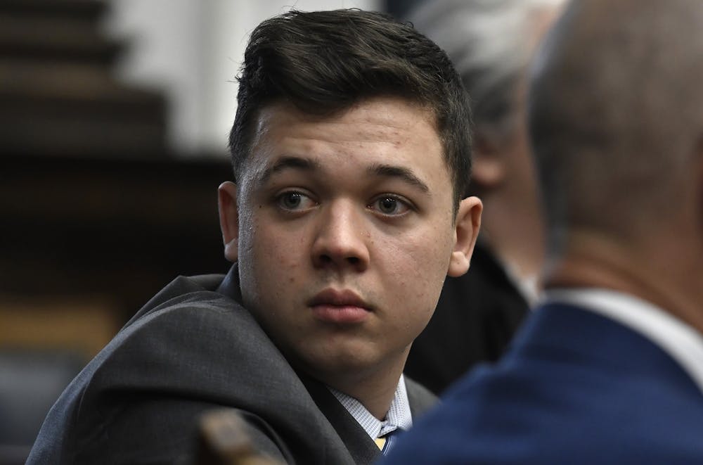 <p>Kyle Rittenhouse looks back as attorneys discuss items in the motion for mistrial presented by his defense during his trial at the Kenosha County Courthouse Nov. 17, 2021, in Kenosha, Wisconsin. Rittenhouse was acquitted of all five charges Nov. 19. <strong>Sean Krajacic/Pool/Getty Images/ Tribune News Service, Photo Courtesy</strong></p>