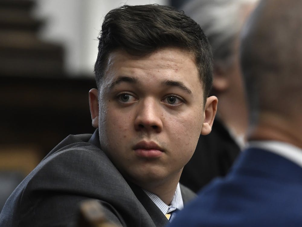 Kyle Rittenhouse looks back as attorneys discuss items in the motion for mistrial presented by his defense during his trial at the Kenosha County Courthouse Nov. 17, 2021, in Kenosha, Wisconsin. Rittenhouse was acquitted of all five charges Nov. 19. Sean Krajacic/Pool/Getty Images/ Tribune News Service, Photo Courtesy