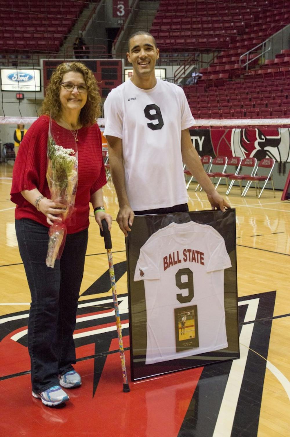 Senior middle attacker Julian Welsh-White and his mother smile as they are honored as a part of senior night after the game against Loyola on March 28 at Worthen Arena. DN PHOTO ALAINA JAYE HALSEY