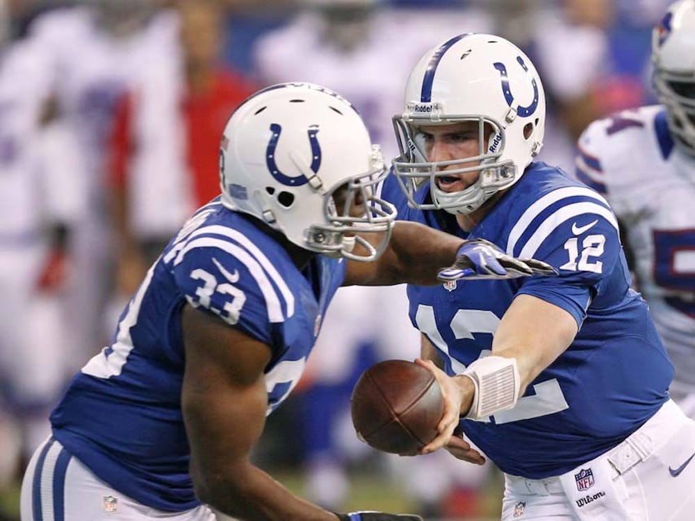 Indianapolis Colts quarterback Andrew Luck (12) hands off to Indianapolis Colts running back Vick Ballard (33) on Sunday in Indianapolis, Ind. The Colts won the game against the Bills 20-13. MCT PHOTO