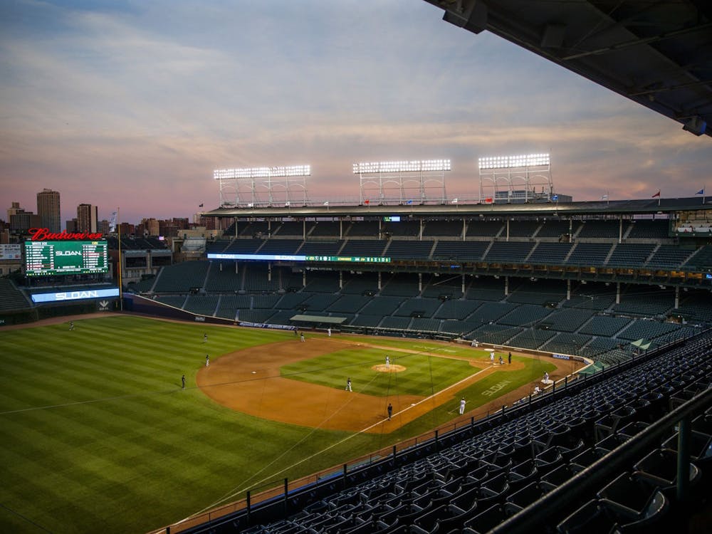 The sun sets during the fourth inning of an exhibition game between the Cubs and White Sox at Wrigley Field on July 19, 2020, in Chicago. TNS, Photo Courtesy