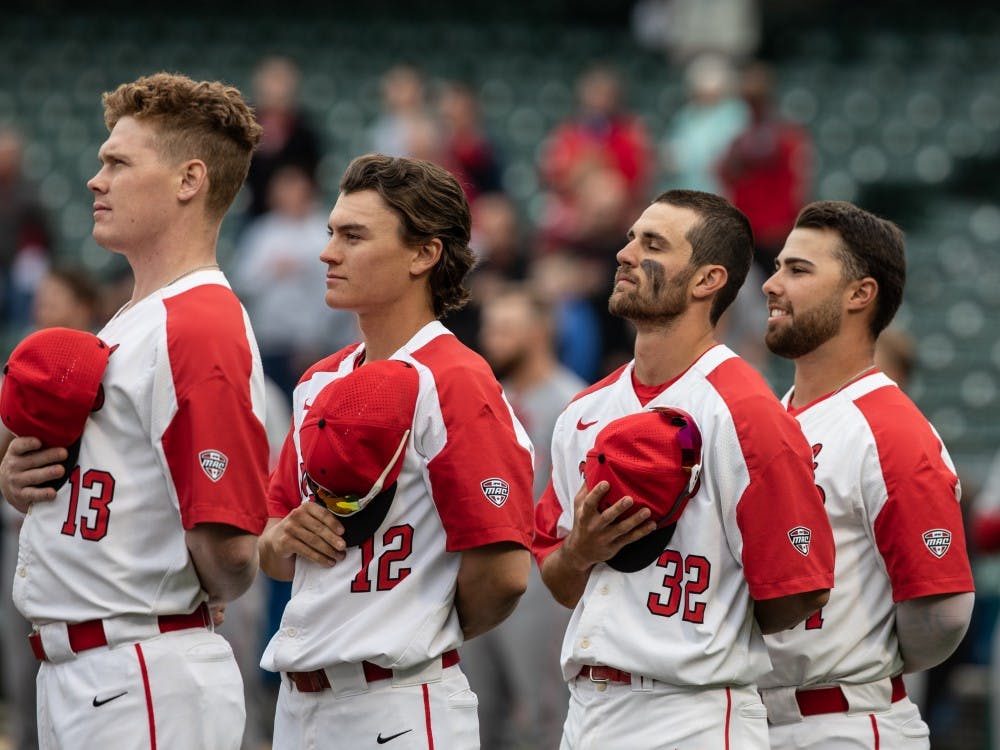 Ball State Cardinals take off their hats as the National Anthem plays at Victory Field April 23, 2019. The Cardinals lost to the Hoosiers. Rebecca Slezak,DN