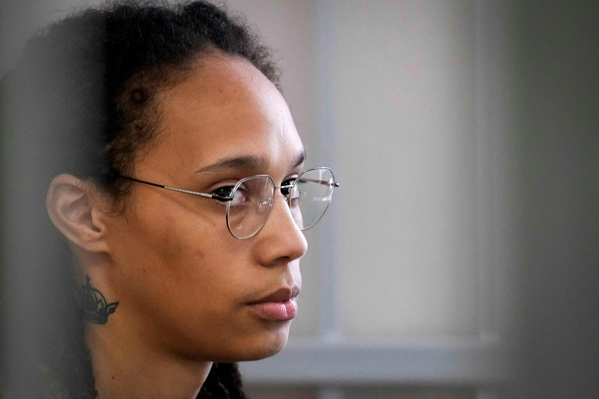 U.S. WNBA basketball superstar Brittney Griner sits inside a defendants' cage before a hearing at the Khimki Court, outside Moscow on July 27, 2022. (Alexander Zemlianichenko/Pool/AFP/Getty Images/TNS)