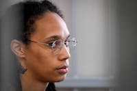 U.S. WNBA basketball superstar Brittney Griner sits inside a defendants' cage before a hearing at the Khimki Court, outside Moscow on July 27, 2022. (Alexander Zemlianichenko/Pool/AFP/Getty Images/TNS)