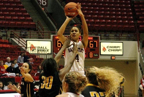 Freshman guard Nathalie Fontaine jumps over her defender late in the second half the Northern Kentucky game. Fontaine finished the night with 15 points. DN PHOTO JACQUELYN BRAZZALE