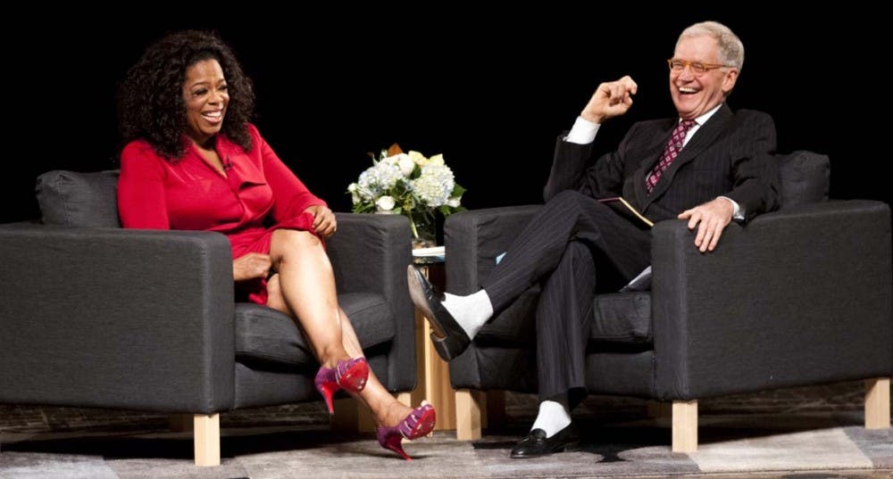 Oprah Winfrey and David Letterman laugh during their talk. DN PHOTO BOBBY ELLIS
