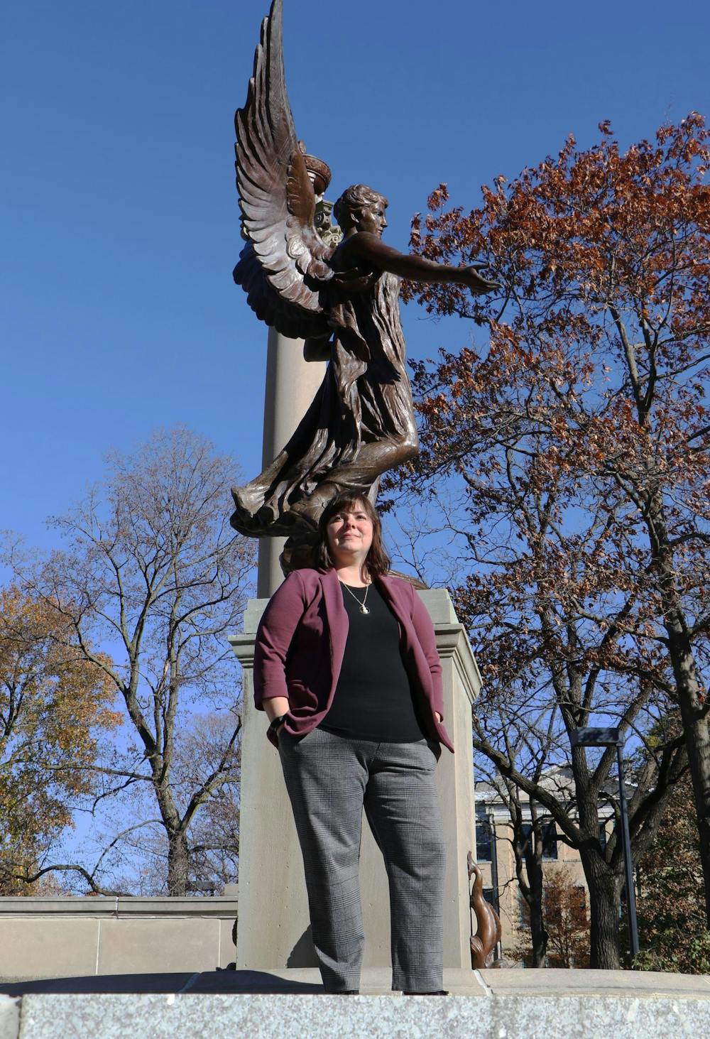  Assistant teaching professor of criminal justice and criminology Brandy Rocheleau poses for a photo Nov. 13 in front of the Beneficence statue. Rocheleau was one of three projects funded by Women of Beneficence in 2023. Grayson Joslin, DN