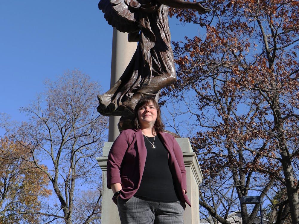  Assistant teaching professor of criminal justice and criminology Brandy Rocheleau poses for a photo Nov. 13 in front of the Beneficence statue. Rocheleau was one of three projects funded by Women of Beneficence in 2023. Grayson Joslin, DN