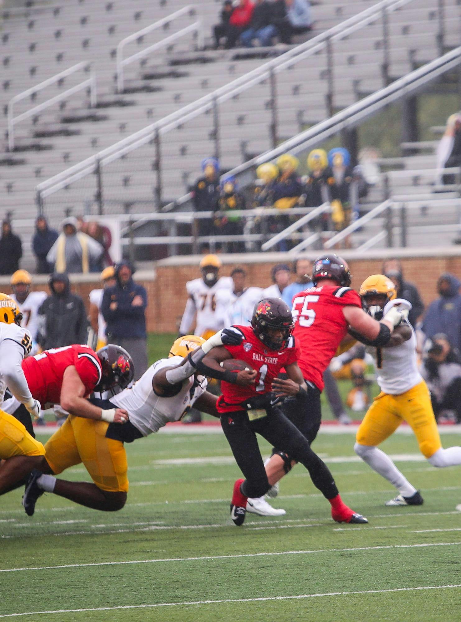 Redshirt sophmore quarterback Kiael Kelly runs the ball in a game against Toledo Oct 14 at Sceumann Stadium. Kelly threw 38 yards and rushed for 98 in the game. Andrew Berger, DN