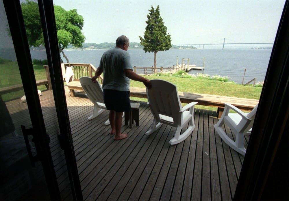 KRT LIFESTYLE STORY SLUGGED: HOGISLAND KRT PHOTOGRAPH BY REUBEN PEREZ/PROVIDENCE JOURNAL (June 21) Sam Romano has a view of Narragansett Bay and Mt. Hope Bridge from his family's summer home on Hog Island, Rhode Island.  (PJB) NC KD 2001 (Horiz) (mvw) -- NO MAGS, NO SALES --