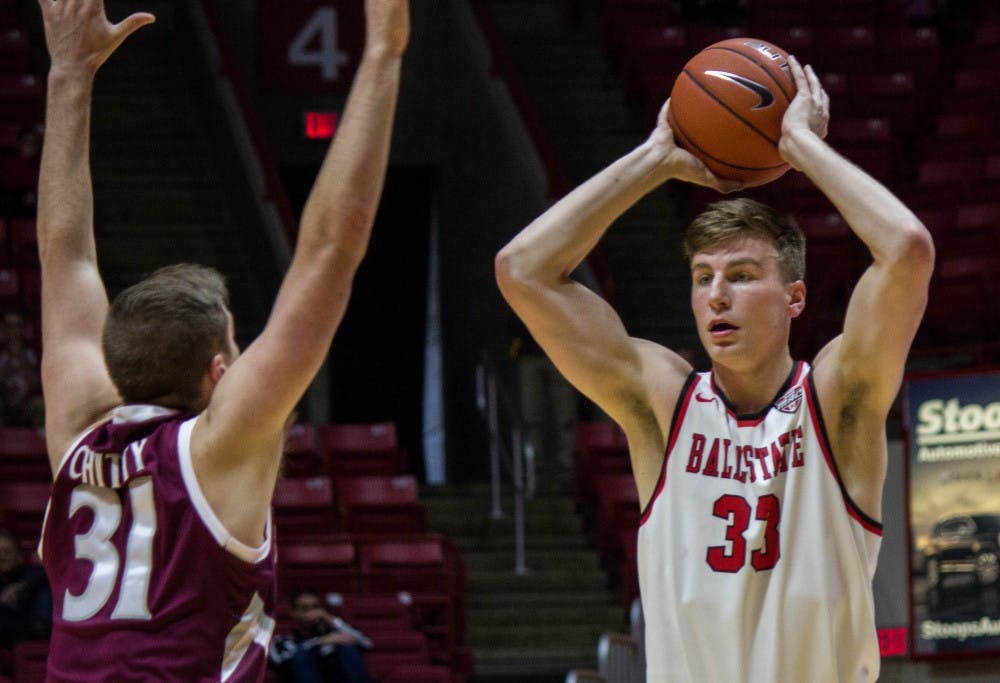 Ball State guard/forward Ryan Weber looks to pass the ball during the game against Eastern Kentucky on Dec. 10 in Worthen Arena. Ball State won 91-86 in overtime. Grace Ramey // DN