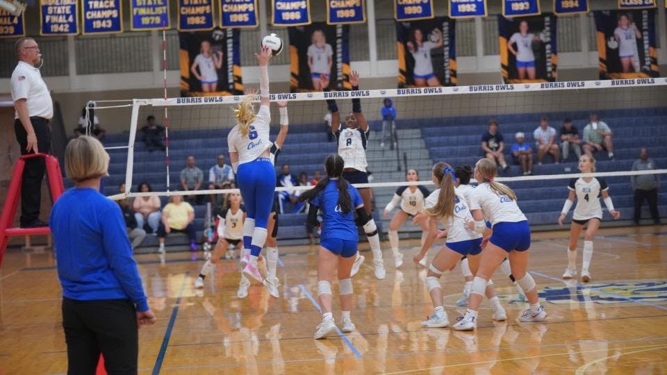 Emma Cukrowicz (#6) leaps high above the net to deliver a decisive spike, sealing the match point and the fourth set 25‑20, clinching the 3‑1 victory over the Eagles. Photo by BRODERICK GOOD.