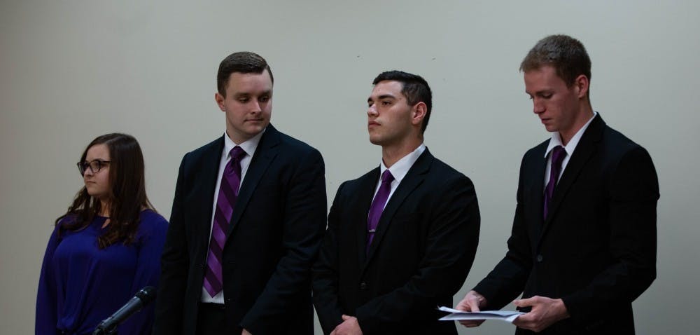 (Left to Right) Elevate's Cassidy Mattingly, secretarial candidate, Cameron DeBlasio, vice presidential candidate, Aiden Medellin, presidential candidate, and David Sinclair, treasurer candidate stand before the All-Slate Debate Feb. 18, 2019 in the L.A. Pittenger Student Center ballroom. Scott Fleener, DN&nbsp;